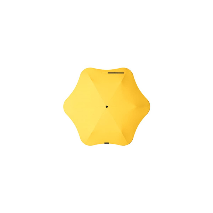 A yellow BLUNT Neo Umbrella with a unique star-shaped design and a central black button.