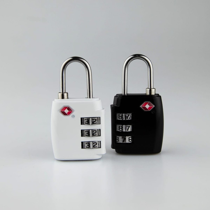 Two TSA locks are displayed: one white and one black, both featuring a combination dial and a logo.