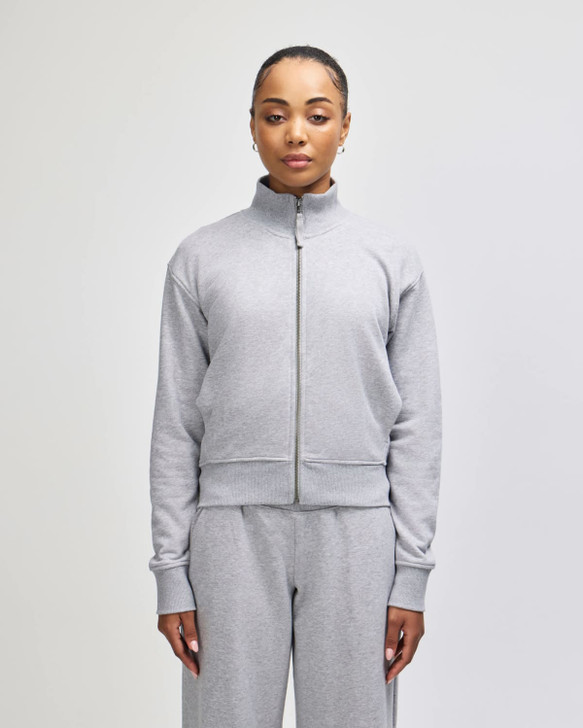 A grey full-zip jacket with a stand collar, featuring a fitted design and long sleeves. Contains a logo.