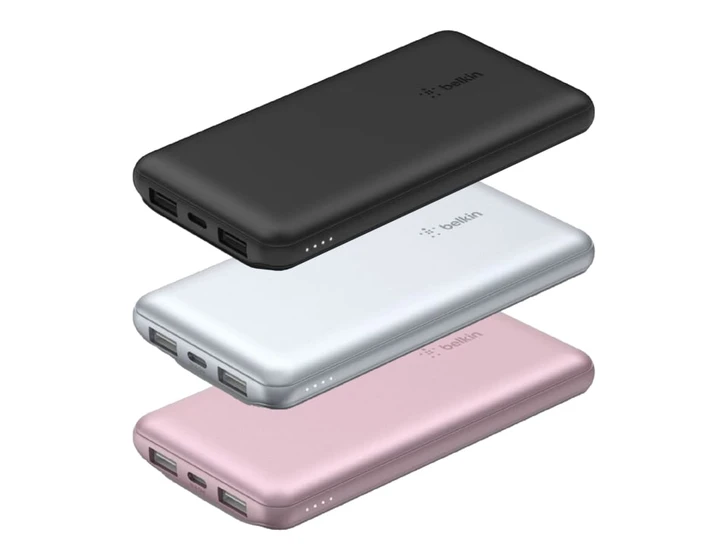 A set of three power banks in black, silver, and rose gold, featuring USB ports and a logo on each.