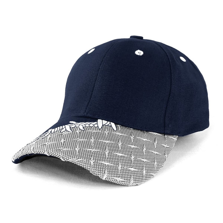 A navy cap with a patterned peak and a logo on the front.