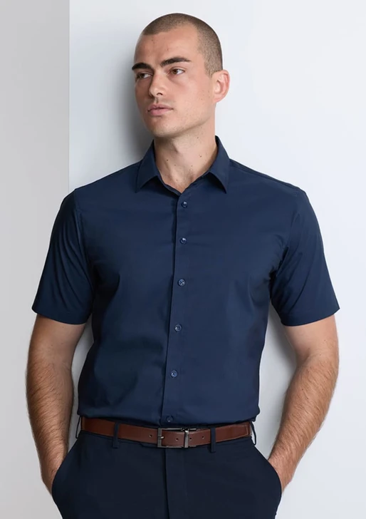 A classic fit short sleeve shirt in navy, featuring a button-up front and a subtle branding logo.