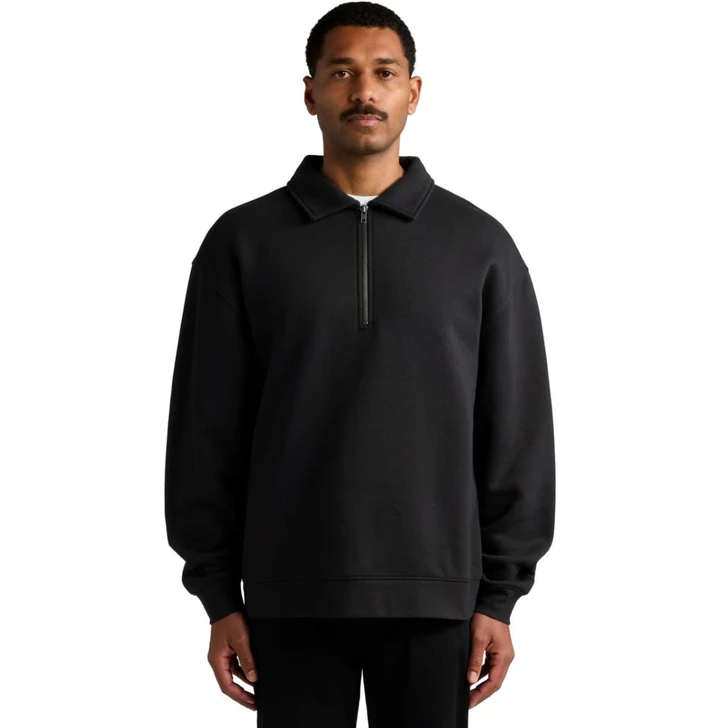 A black collared crew jumper with a zip detail, featuring a relaxed fit and long sleeves. It has a logo on the garment.