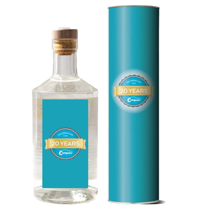 A drink bottle filled with clear gin, displayed with a cylindrical turquoise packaging, featuring a logo.