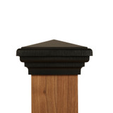 Front View of a Four by four 4x4 Black Pyramid Post Cap on a wood grain post