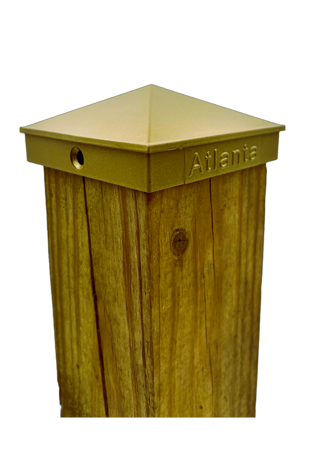 4x4 Post cap gold in color on a 3.5 inch wood post