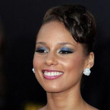 Alicia Keys sports dangling hair jewelry during Paris Fashion Week