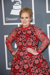 Adele wows in red frock at Grammys