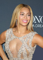 Beyonce glistens in gold at recent premiere