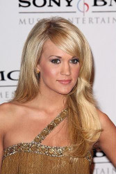 Carrie Underwood flaunts silver style at Country 2 Country Festival