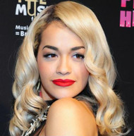 Rita Ora rocks shimmering mini to charity event