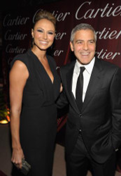 Stacy Keibler and George Clooney talk fashion on the Palm Springs red carpet