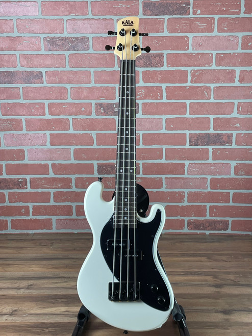 Innovative Kala Solid Body U-Bass in Sweet Cream with 23.5" scale, authentic bass tone, and 2.7 lb weight. Perfect portable bass solution. No Limit Guitar Co, Idaho Falls.