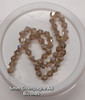 Strand of glass bicone beads - approx 6mm, Champagne AB, approx 50 beads