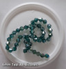Strand of glass bicone beads - approx 6mm, Teal AB, approx 50 beads