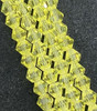 Strand of glass bicone beads - approx 6mm, Light Yellow, approx 52 beads