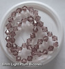 Strand of glass bicone beads - approx 8mm, Light Plum, approx 43 beads