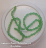 Strand of faceted drop glass beads (briolettes) - approx 6x4mm, Green Translucent, approx 72 beads