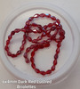 Strand of faceted drop glass beads (briolettes) - approx 6x4mm, Dark Red Lustered , approx 72 beads