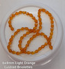 Strand of faceted drop glass beads (briolettes) - approx 6x4mm, Light Orange Lustered , approx 72 beads