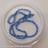 Strand of faceted drop glass beads (briolettes) - approx 6x4mm, Tanzanite (Light Blue), approx 72 beads