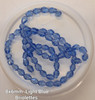 Strand of faceted drop glass beads (briolettes) - approx 8x6mm, Light Blue, approx 72 beads