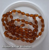 Strand of faceted drop glass beads (briolettes) - approx 8x6mm, Amber, approx 72 beads