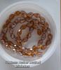 Strand of faceted drop glass beads (briolettes) - approx 12x8mm, Amber Lustered, approx 60 beads