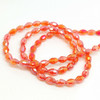 Strand of faceted rice glass beads - approx 6x4mm, Orange-Red AB , approx 72 beads