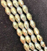 Strand of faceted rice glass beads - approx 6x4mm, Grey AB , approx 72 beads