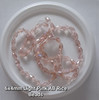 Strand of faceted rice glass beads - approx 6x4mm, Light Pink AB, approx 72 beads