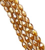 Strand of faceted rice glass beads - approx 6x4mm, Amber Lustered , approx 72 beads