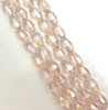 Strand of faceted rice glass beads - approx 6x4mm, Pale Pink Lustered, approx 72 beads