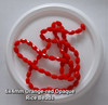 Strand of faceted rice glass beads - approx 6x4mm, Orange-Red Opaque, approx 72 beads