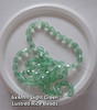 Strand of faceted rice glass beads - approx 6x4mm, Pale Green Translucent , approx 72 beads