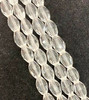 Strand of faceted rice glass beads - approx 6x4mm, Clear, approx 72 beads
