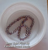 Strand of faceted round glass beads - approx 6mm, Light Plum AB, approx 50 beads, 12in