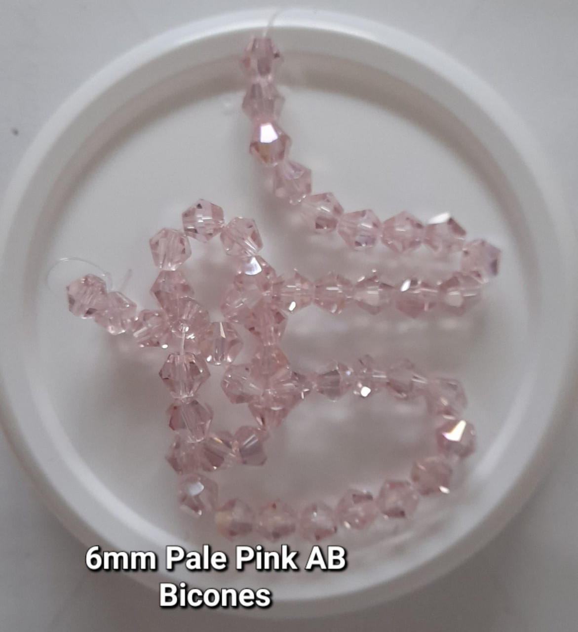 Strand of glass bicone beads - approx 6mm, Pale Pink AB, approx 50 beads