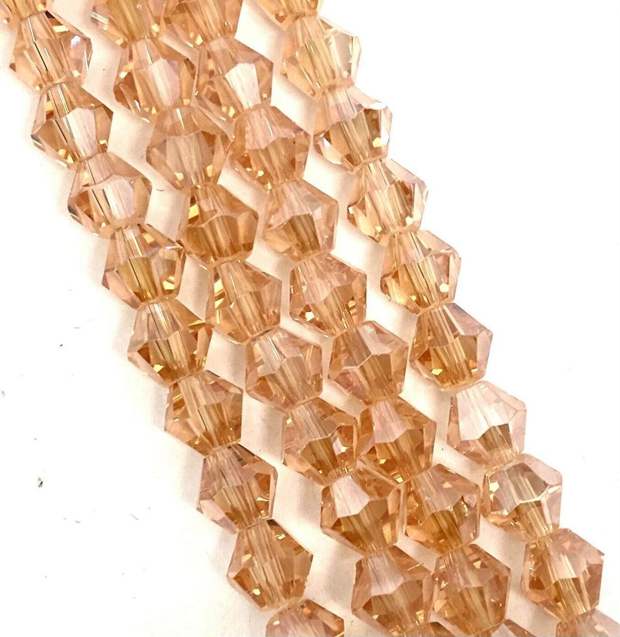 Strand of glass bicone beads - approx 6mm, Peach Lustered, approx 52 beads