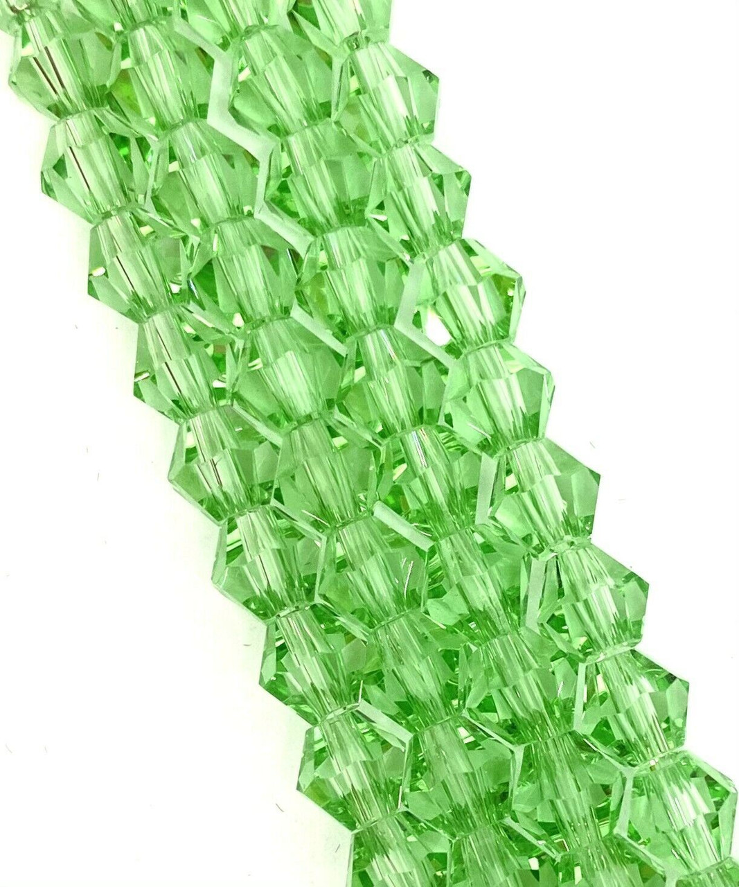 Strand of glass bicone beads - approx 8mm, Light Green, approx 43 beads