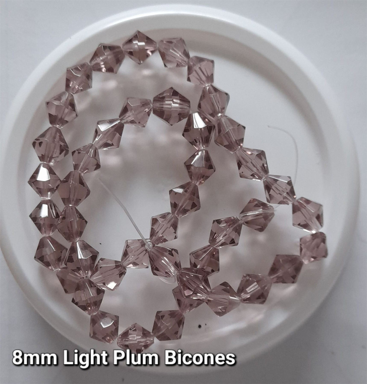 Strand of glass bicone beads - approx 8mm, Light Plum, approx 43 beads