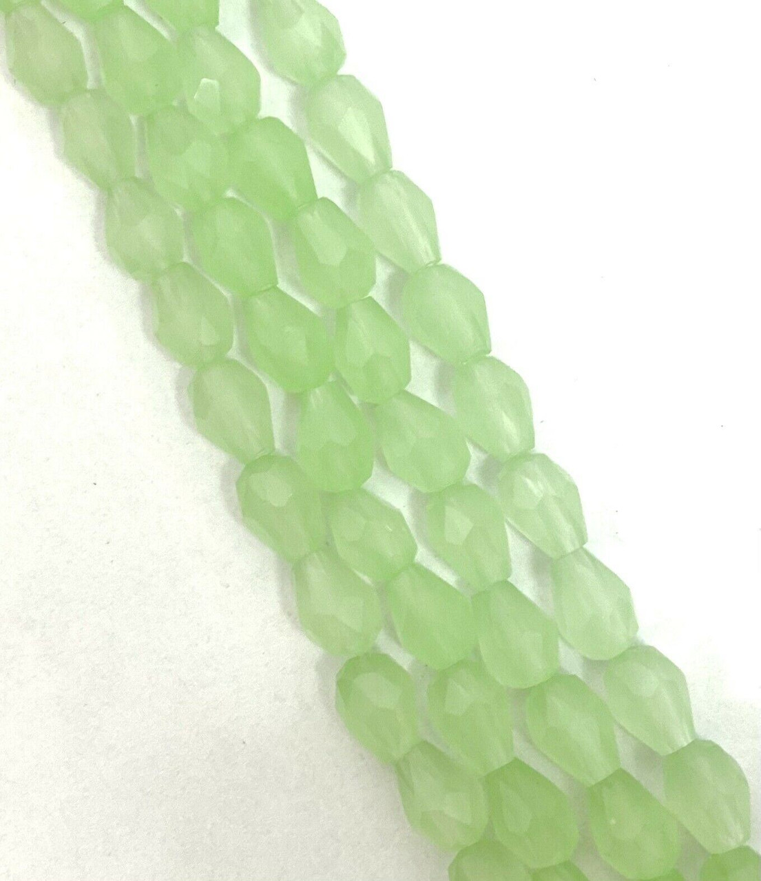 Strand of faceted drop glass beads (briolettes) - approx 6x4mm, Pale Green Translucent, approx 72 beads