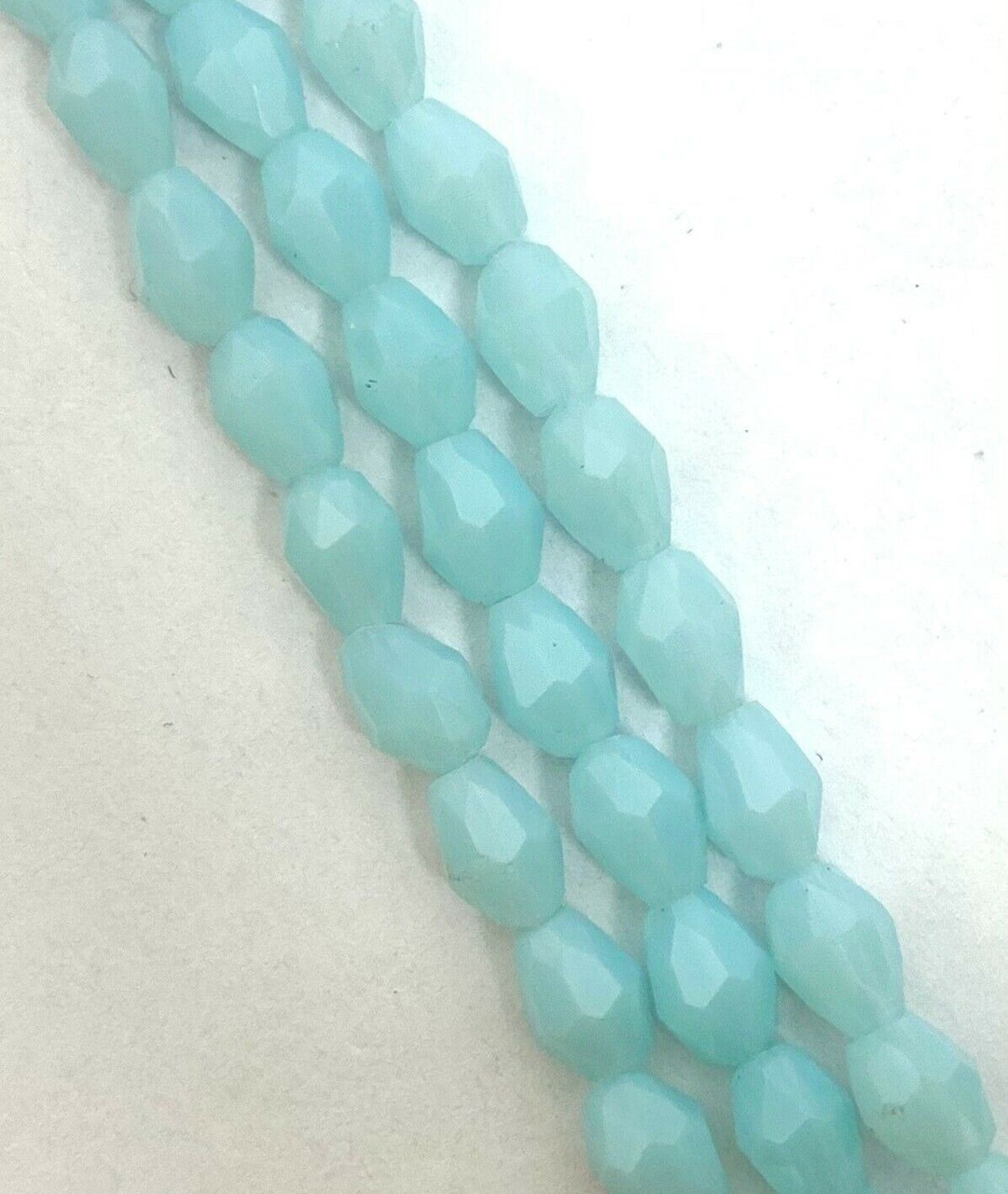 Strand of faceted drop glass beads (briolettes) - approx 6x4mm, Pale Aqua Translucent, approx 72 beads