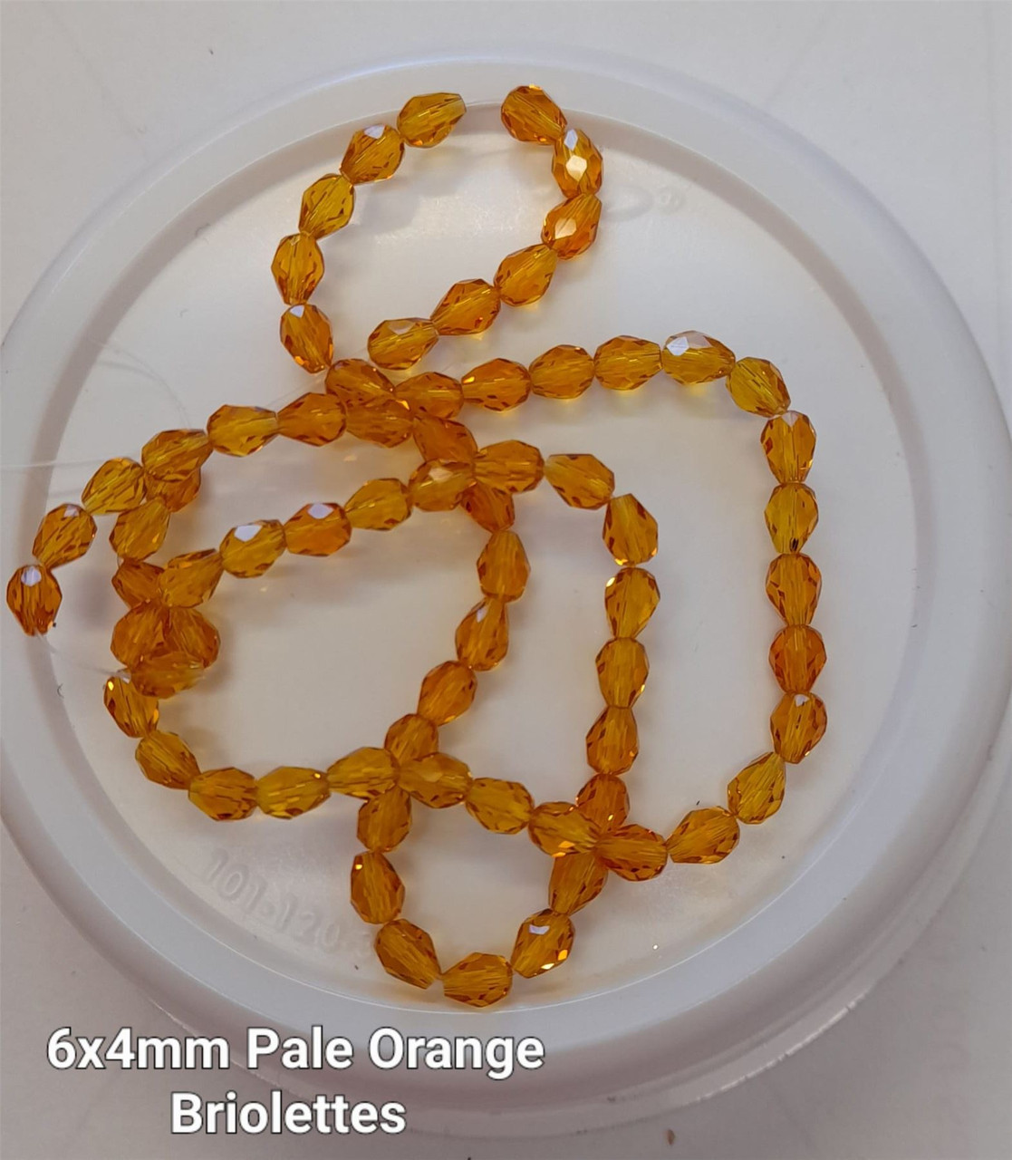 Strand of faceted drop glass beads (briolettes) - approx 6x4mm, Light Orange , approx 72 beads