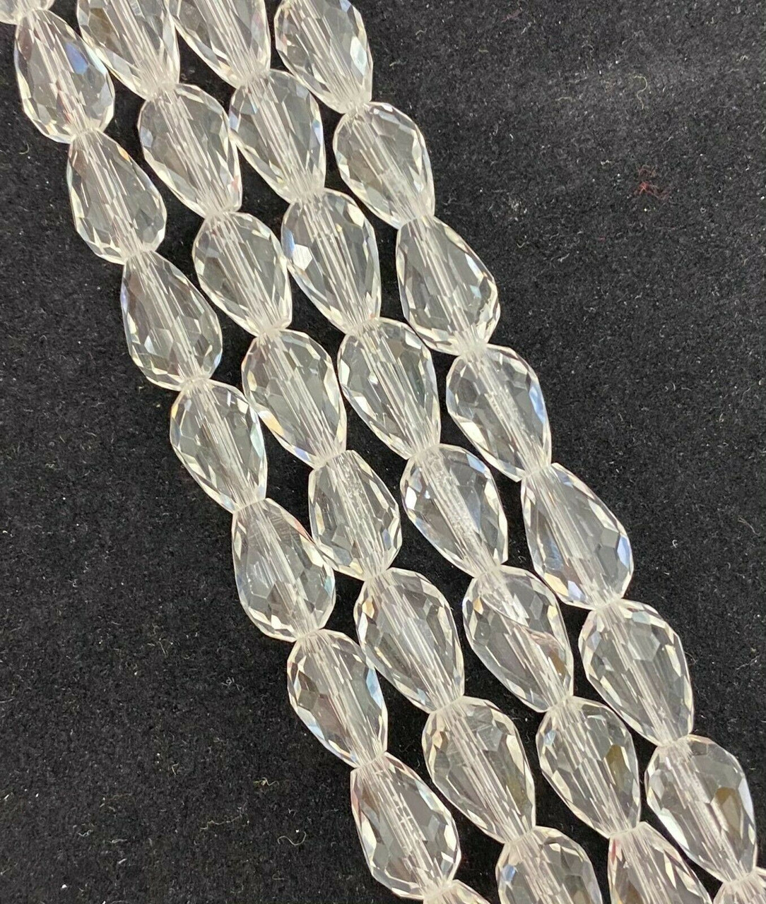 Strand of faceted drop glass beads (briolettes) - approx 6x4mm, Clear, approx 72 beads