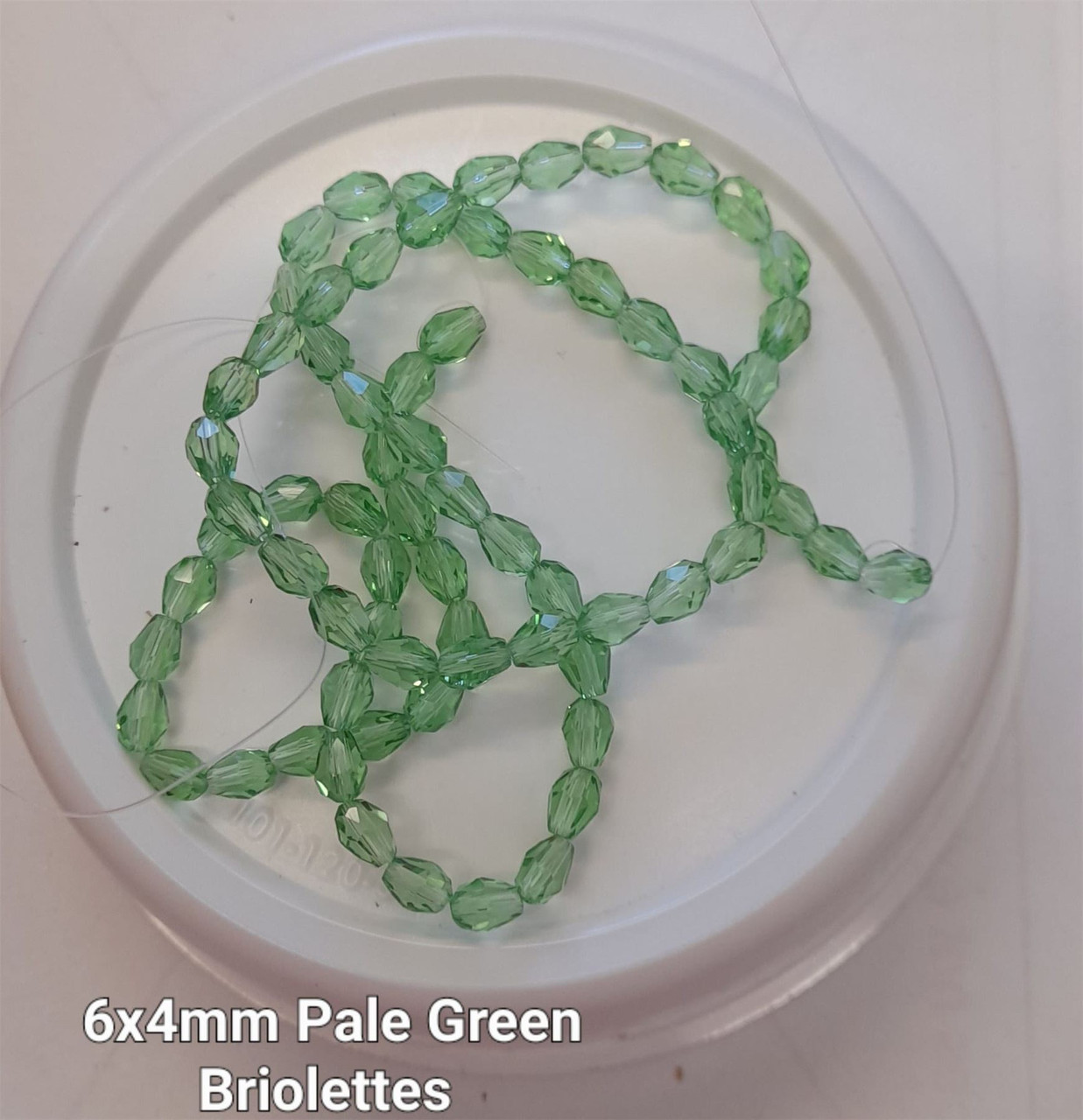 Strand of faceted drop glass beads (briolettes) - approx 6x4mm, Pale Green , approx 72 beads