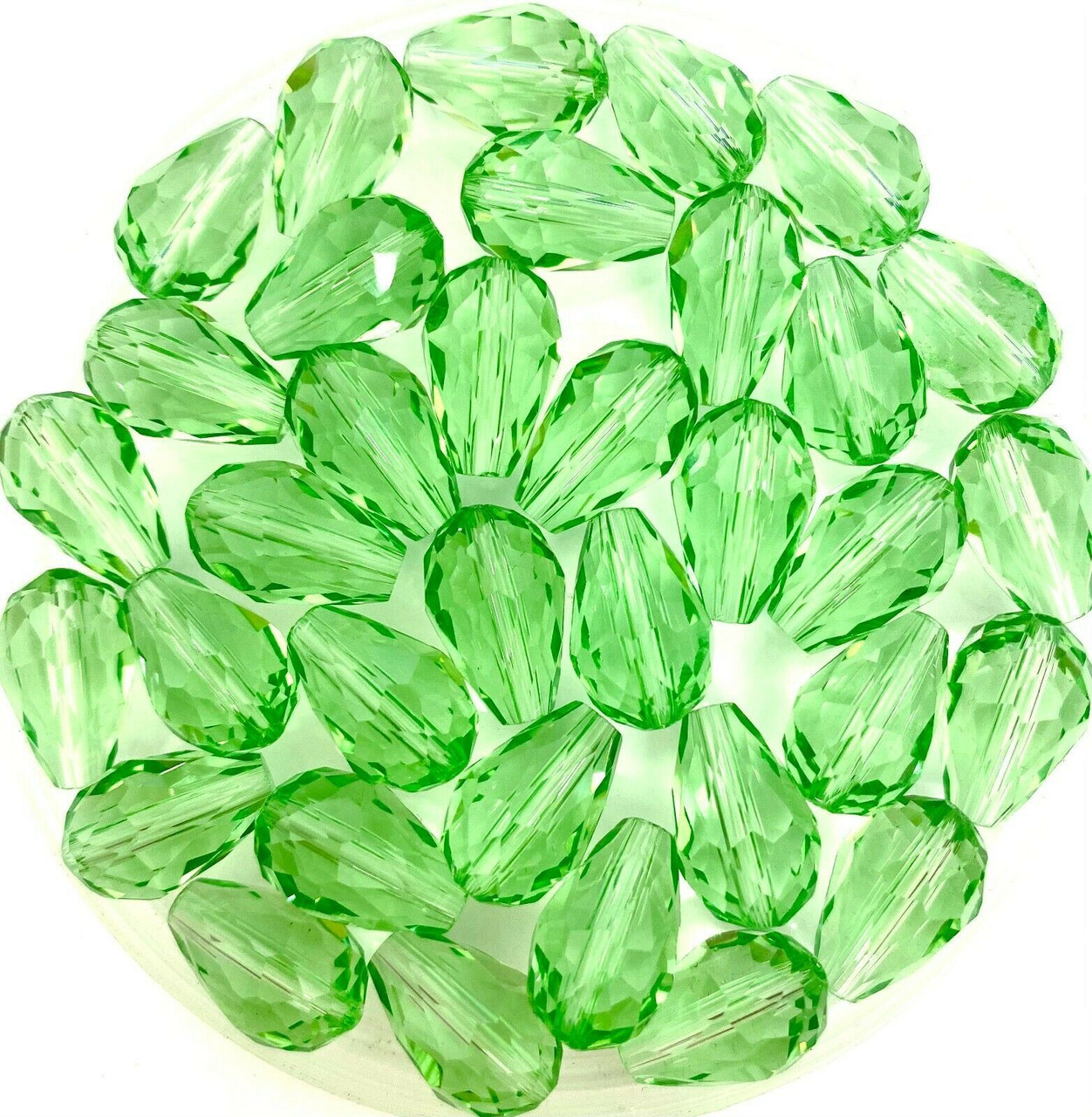 Strand of faceted drop glass beads (briolettes) - approx 7x5mm, Pale Green, approx 70 beads
