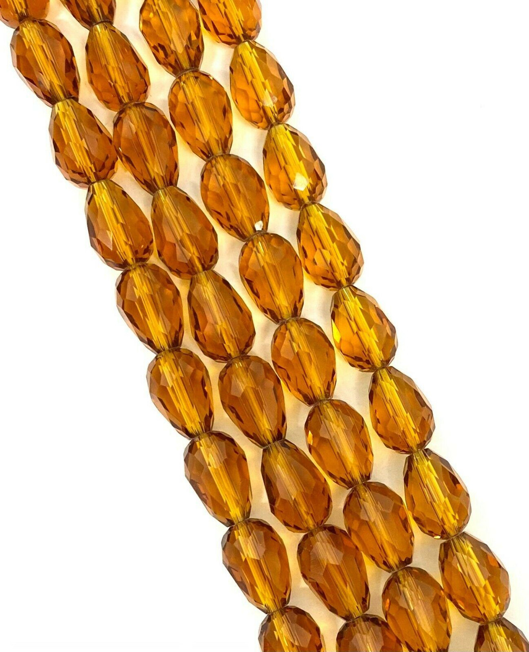 Strand of faceted drop glass beads (briolettes) - approx 7x5mm, Amber , approx 70 beads