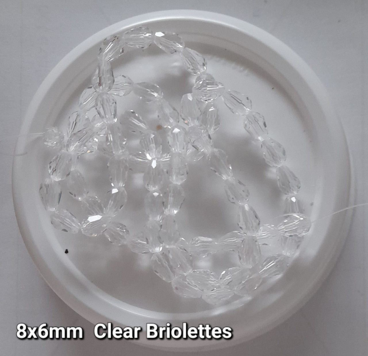 Strand of faceted drop glass beads (briolettes) - approx 8x6mm, Clear , approx 72 beads
