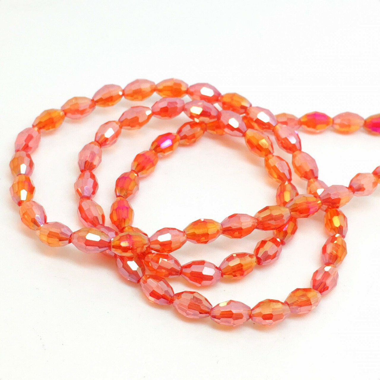 Strand of faceted rice glass beads - approx 6x4mm, Orange-Red AB , approx 72 beads
